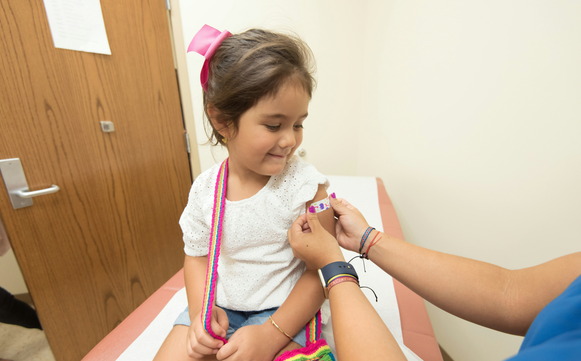 Girl getting flu shot